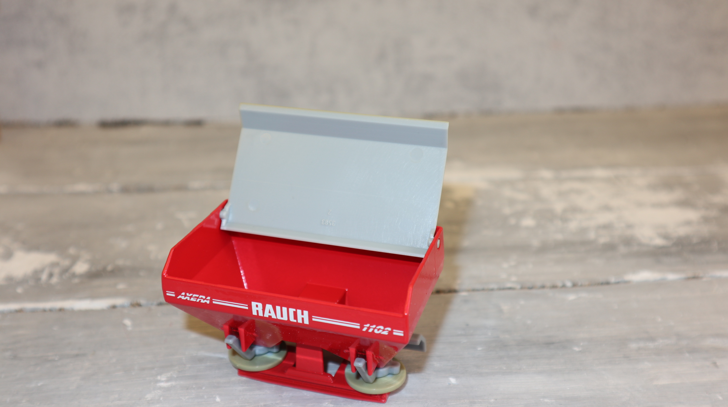 Siku 2050 in 1:32,  Streuer RAUCH AXERA 1102 Werbemodell, NEU in OVP