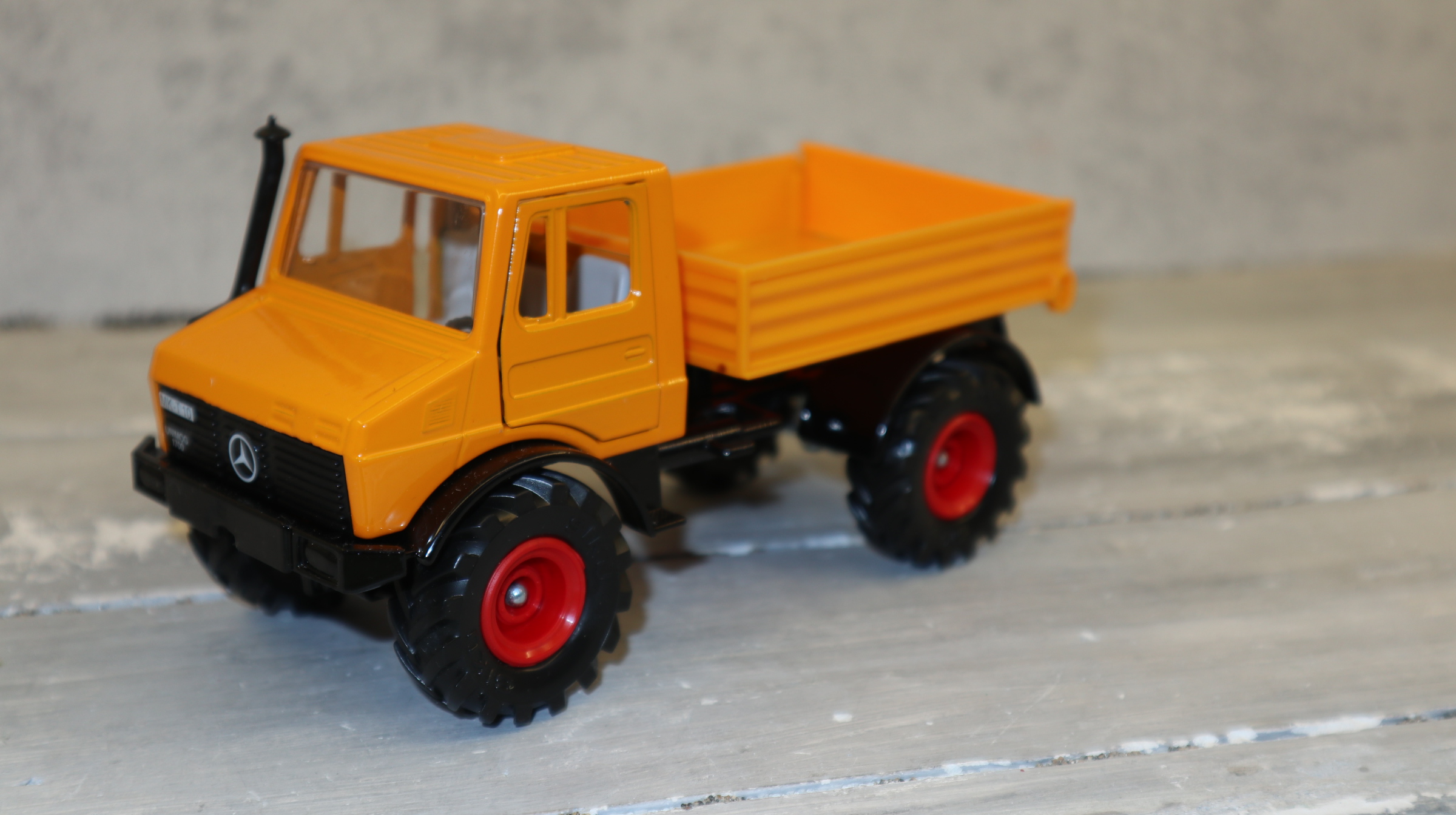 Siku 3153 in 1:32, Unimog 1700 in orange , NEU in OVP