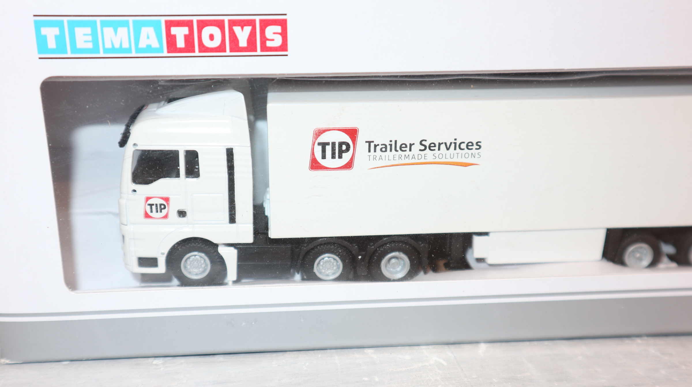 WSI TEMA Toys 08-1194 in 1:87, MAN TGX 6x2 mit Kofferauflieger TIP Trailer Service